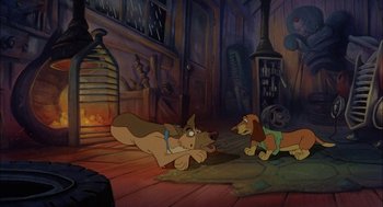 Movie still from “All Dogs Go to Heaven” (1989), directed by Dan Kuenster – A couple of dogs laying on top of a rug; Wide shot, High angle