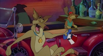 Movie still from “All Dogs Go to Heaven” (1989), directed by Dan Kuenster – Two dogs are sitting in the back of a red car; Medium shot, High angle