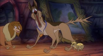 Movie still from “All Dogs Go to Heaven” (1989), directed by Dan Kuenster – A dog and a cat are walking in a room together; Medium shot, Low angle