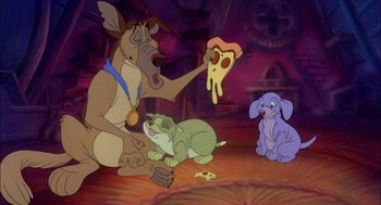 Movie still from “All Dogs Go to Heaven” (1989), directed by Dan Kuenster – A group of cartoon characters sitting on the floor; Wide shot, High angle