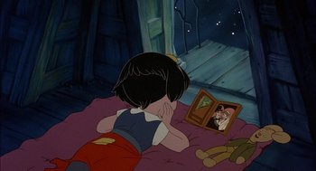 Movie still from “All Dogs Go to Heaven” (1989), directed by Dan Kuenster – A little girl looking in a mirror at a picture of a cat; Wide shot, High angle