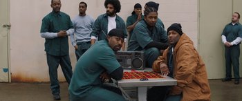 A group of men sitting next to each other in a room