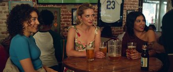 Movie still from “All My Life” (2020), directed by Marc Meyers – A woman sitting at a table with two glasses of beer in front of her; Medium shot, Over the shoulder angle