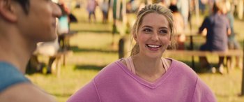 Movie still from “All My Life” (2020), directed by Marc Meyers – A woman in a pink shirt smiling for the camera; Close Up shot, Over the shoulder angle