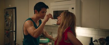 Movie still from “All My Life” (2020), directed by Marc Meyers – A man feeding a woman a piece of food from a spoon; Medium shot, Over the shoulder angle