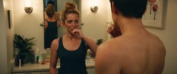 Movie still from “All My Life” (2020), directed by Marc Meyers – A woman brushing her teeth in front of a mirror; Close Up shot, Over the shoulder angle