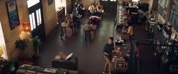 Movie still from “All My Life” (2020), directed by Marc Meyers – People are sitting at tables in a restaurant; Wide shot, High angle