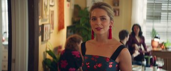 Movie still from “All My Life” (2020), directed by Marc Meyers – A woman with long red earrings standing in a room; Close Up shot, Over the shoulder angle