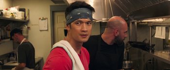 Movie still from “All My Life” (2020), directed by Marc Meyers – A man with a bandage on his head and a towel around his neck; Close Up shot, Over the shoulder angle