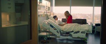 Movie still from “All My Life” (2020), directed by Marc Meyers – A man and a woman sitting in a hospital bed; Wide shot, High angle