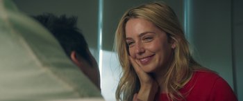 Movie still from “All My Life” (2020), directed by Marc Meyers – A beautiful blonde woman smiling at the camera; Close Up shot, Over the shoulder angle