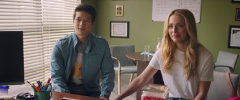 Movie still from “All My Life” (2020), directed by Marc Meyers – A man and a woman sitting at a table in front of a computer; Medium shot, Over the shoulder angle