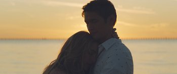 Movie still from “All My Life” (2020), directed by Marc Meyers – A man and a woman hugging in front of the ocean; Close Up shot, Low angle