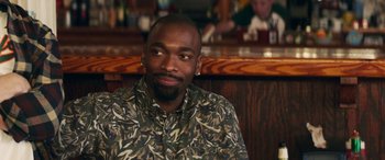 Movie still from “All My Life” (2020), directed by Marc Meyers – A person sitting in front of a wooden wall; Close Up shot, Over the shoulder angle