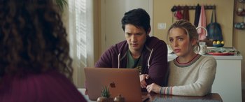 Movie still from “All My Life” (2020), directed by Marc Meyers – A man sitting at a table looking at a computer; Medium shot, Over the shoulder angle