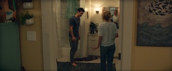 Movie still from “All My Life” (2020), directed by Marc Meyers – A man and a woman standing in a bathroom; Wide shot, Over the shoulder angle