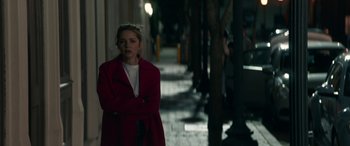 Movie still from “All My Life” (2020), directed by Marc Meyers – A woman in a red coat standing on a sidewalk; Medium shot, Over the shoulder angle
