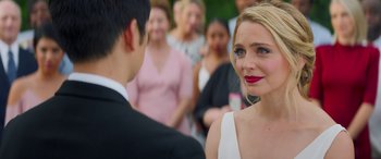 Movie still from “All My Life” (2020), directed by Marc Meyers – A man and a woman standing next to each other in front of a crowd; Close Up shot, Over the shoulder angle