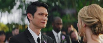 Movie still from “All My Life” (2020), directed by Marc Meyers – A man in a suit and tie standing next to another man in a suit and tie; Close Up shot, Over the shoulder angle