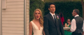 Movie still from “All My Life” (2020), directed by Marc Meyers – A man and a woman standing next to each other in front of a building; Medium shot, Over the shoulder angle