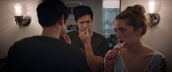 Movie still from “All My Life” (2020), directed by Marc Meyers – A man brushing his teeth in front of two other people; Close Up shot, Over the shoulder angle