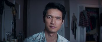 Movie still from “All My Life” (2020), directed by Marc Meyers – A person wearing a floral shirt; Close Up shot, Over the shoulder angle