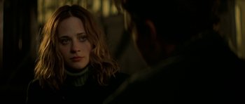 Movie still from “All the Real Girls” (2003), directed by David Gordon Green – A woman in a black sweater is looking at a man in a green sweater; Close Up shot, Over the shoulder angle