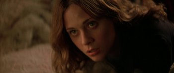 Movie still from “All the Real Girls” (2003), directed by David Gordon Green – A woman's face in a dimly - lit room; Close Up shot, High angle