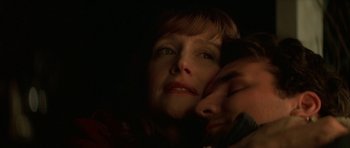 Movie still from “All the Real Girls” (2003), directed by David Gordon Green – A person with their head resting on another person's shoulder; Extreme Close Up shot, Low angle