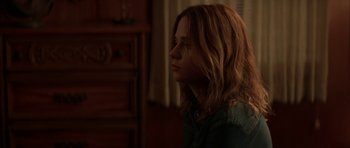 Movie still from “All the Real Girls” (2003), directed by David Gordon Green – A woman with long red hair is looking to her left; Close Up shot, Over the shoulder angle