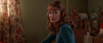 Movie still from “All the Real Girls” (2003), directed by David Gordon Green – A person sitting in a room; Close Up shot, Over the shoulder angle
