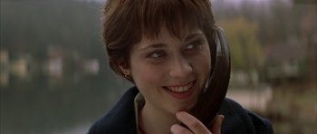 Movie still from “All the Real Girls” (2003), directed by David Gordon Green – A person talking on a cell phone; Close Up shot, Over the shoulder angle