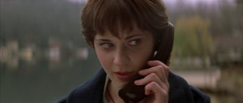 Movie still from “All the Real Girls” (2003), directed by David Gordon Green – A person talking on a cell phone; Close Up shot, High angle