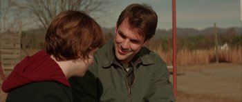 Movie still from “All the Real Girls” (2003), directed by David Gordon Green – A man and a woman are talking to each other; Close Up shot, Over the shoulder angle