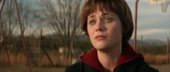 Movie still from “All the Real Girls” (2003), directed by David Gordon Green – A person with short brown hair; Close Up shot, Over the shoulder angle