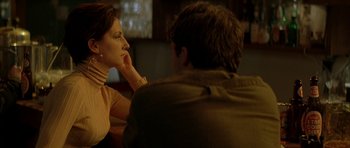 Movie still from “All the Real Girls” (2003), directed by David Gordon Green – A woman sitting next to a man at a table; Close Up shot, Over the shoulder angle