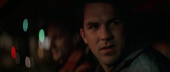 Movie still from “All the Real Girls” (2003), directed by David Gordon Green – A man's face in the dark; Close Up shot, Over the shoulder angle