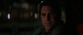 Movie still from “All the Real Girls” (2003), directed by David Gordon Green – A person wearing a jacket; Close Up shot, Over the shoulder angle