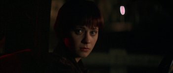 Movie still from “All the Real Girls” (2003), directed by David Gordon Green – A woman with red hair is looking at the camera; Close Up shot, Over the shoulder angle