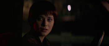 Movie still from “All the Real Girls” (2003), directed by David Gordon Green – A person with short brown hair; Close Up shot, Over the shoulder angle