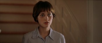 Movie still from “All the Real Girls” (2003), directed by David Gordon Green – A woman with short brown hair wearing a button up shirt; Close Up shot, High angle