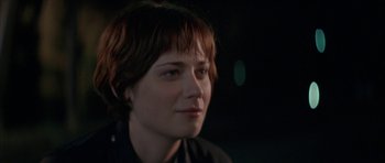 Movie still from “All the Real Girls” (2003), directed by David Gordon Green – A person with short brown hair; Close Up shot, Over the shoulder angle