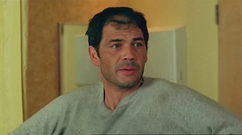 Movie still from “Alligator” (1980), directed by Lewis Teague – A person wearing a sweater; Close Up shot, Low angle