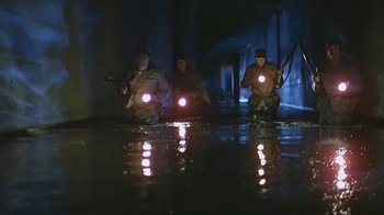Movie still from “Alligator” (1980), directed by Lewis Teague – A group of people in the water with lights on; Wide shot, High angle