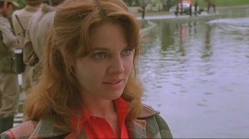 Movie still from “Alligator” (1980), directed by Lewis Teague – A person with long hair; Close Up shot, Over the shoulder angle