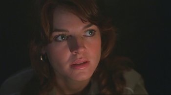 Movie still from “Alligator” (1980), directed by Lewis Teague – A woman's face in the dark; Close Up shot, Low angle