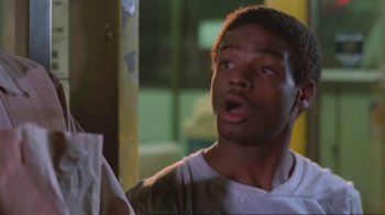 Movie still from “Alligator” (1980), directed by Lewis Teague – A man with a surprised look on his face; Close Up shot, Low angle