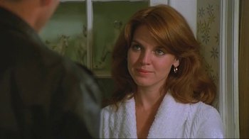 Movie still from “Alligator” (1980), directed by Lewis Teague – A person wearing a white robe; Close Up shot, Over the shoulder angle