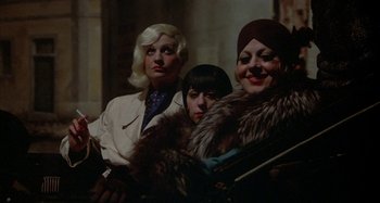 Movie still from “Amarcord” (1973), directed by Federico Fellini – A group of women sitting next to each other; Close Up shot, High angle
