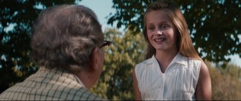 Movie still from “American Pastoral” (2016), directed by Ewan McGregor – An older woman talking to a young girl outside; Close Up shot, Over the shoulder angle